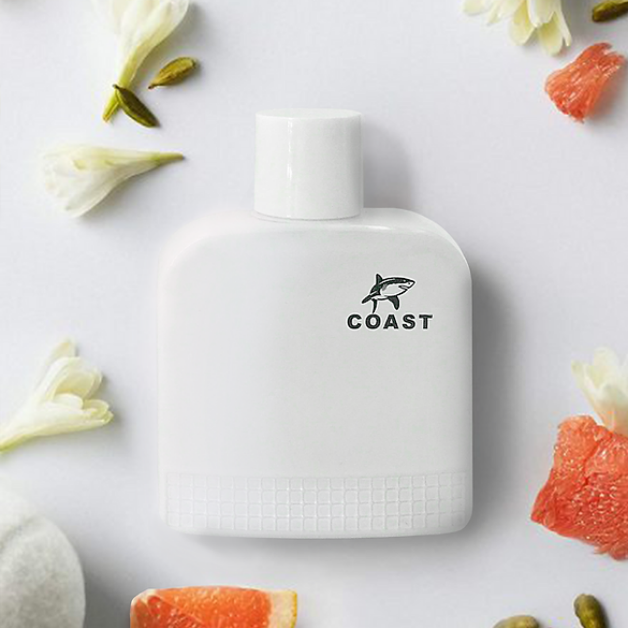 White perfume bottle labeled 'COAST' with floral and fruit elements on a light background. This fragrance is from EBC Collection.