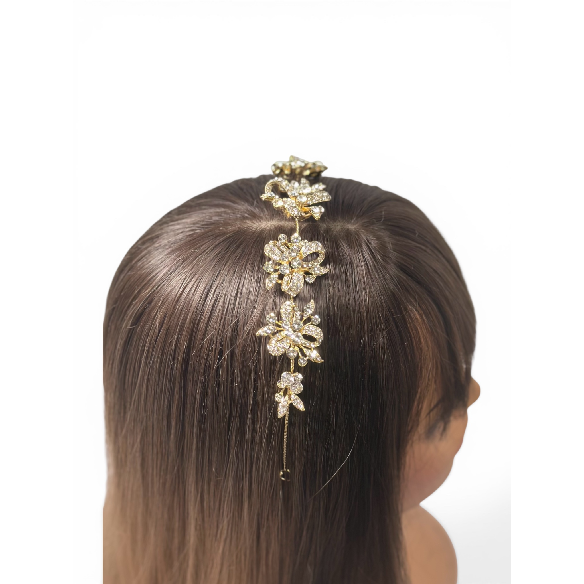 This image showcases the Gold floral headband accessory on a mannequin head with brown hair against a white background.