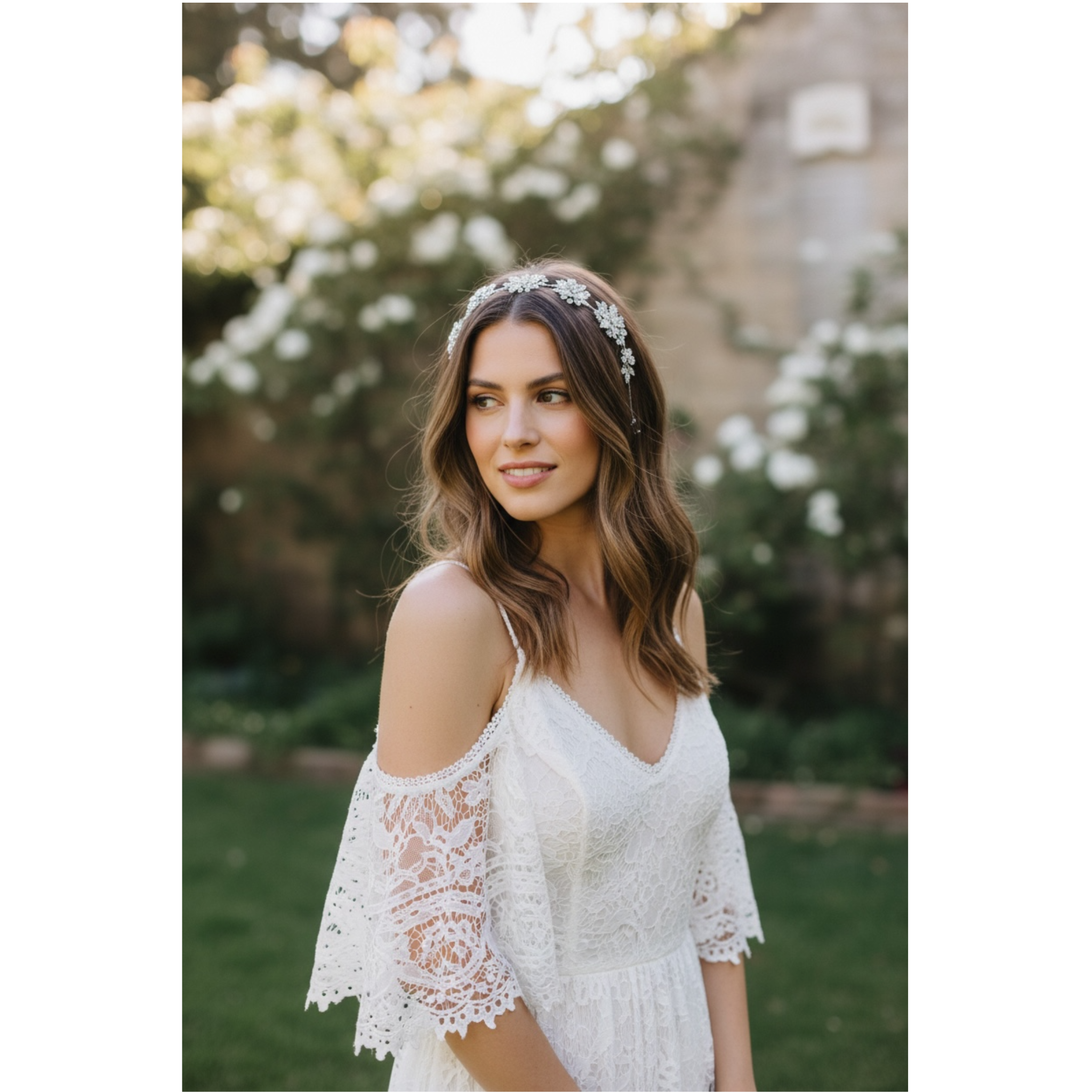 Woman in a white lace dress with floral headband outdoors. This image highlights the headband on the woman's styled hair.