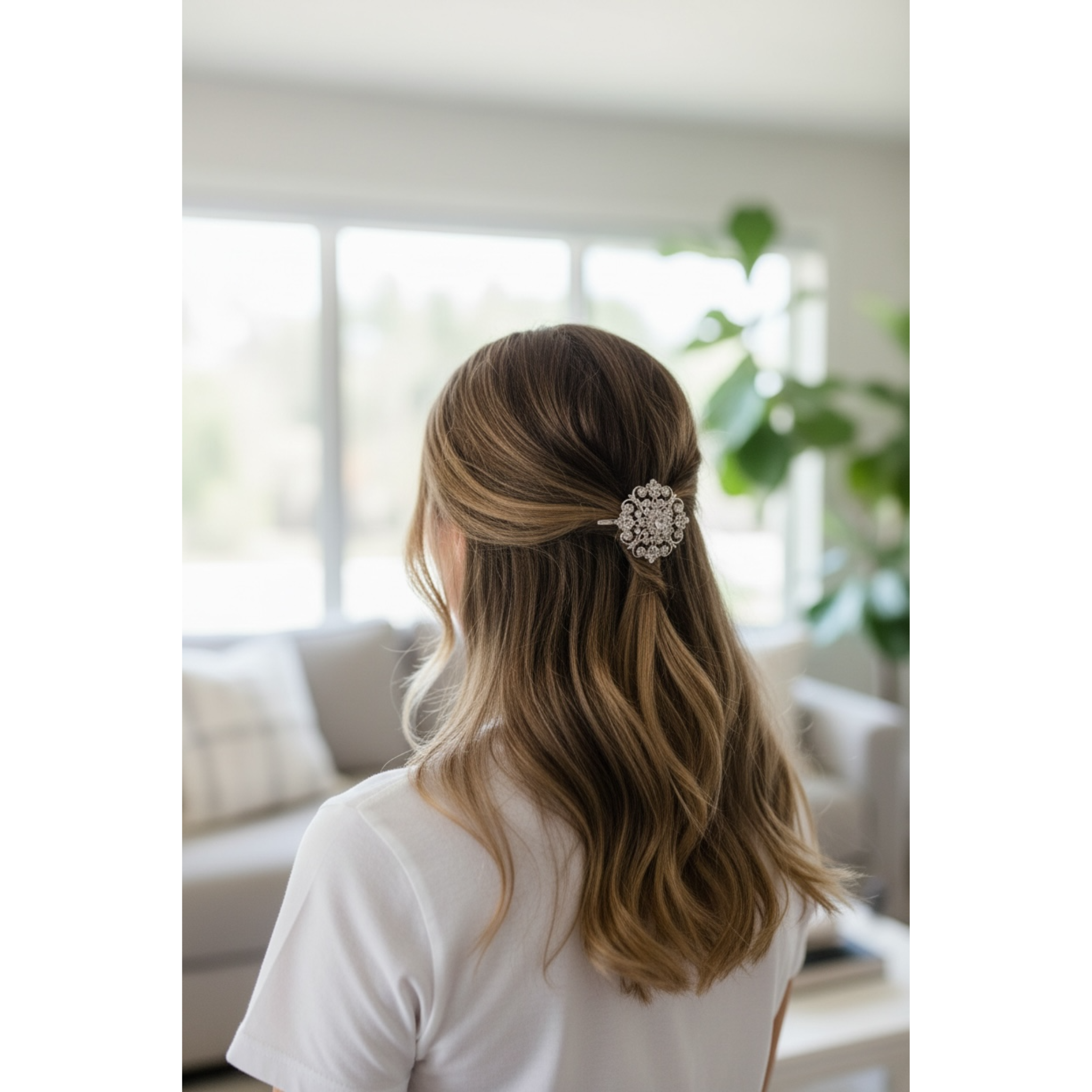 Woman with long hair wearing a decorative hairpin in a blurred indoor setting