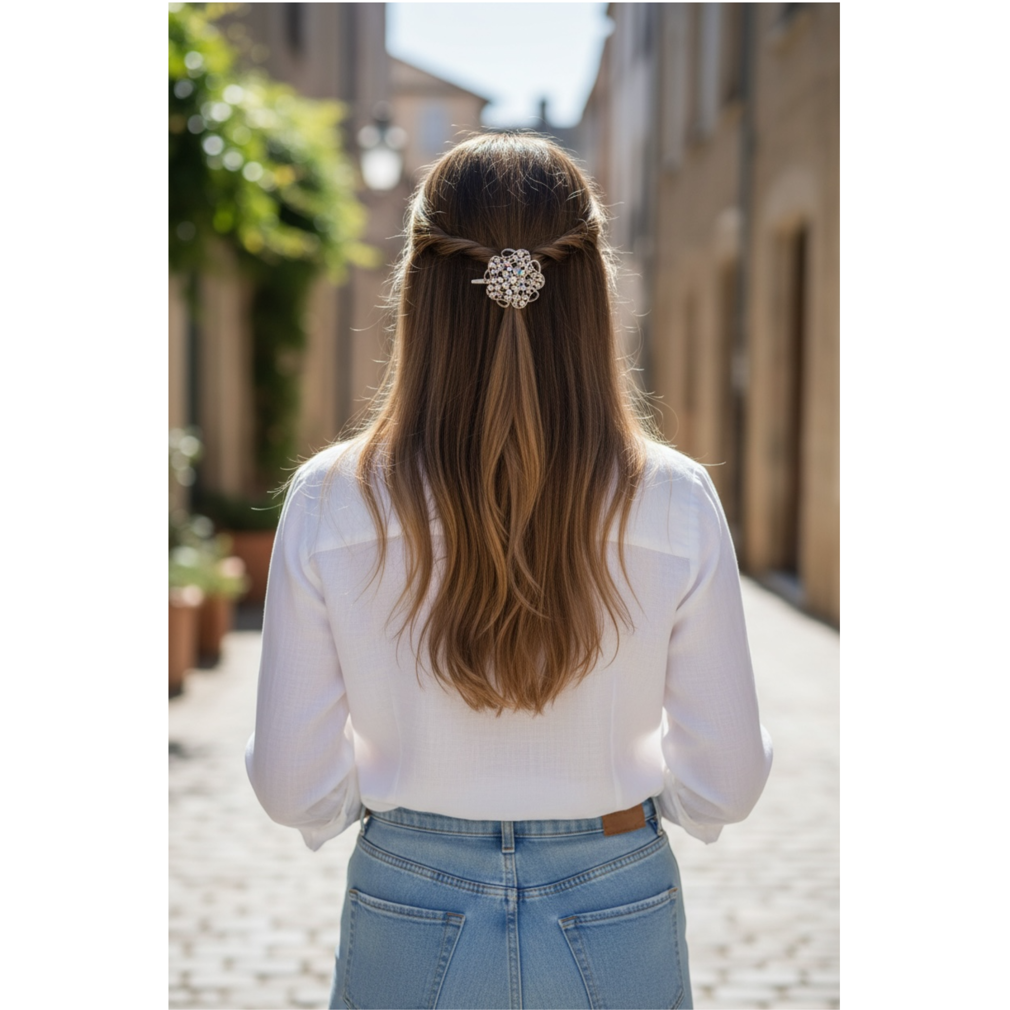 Person with long hair wearing a decorative hairpin, standing on a street.