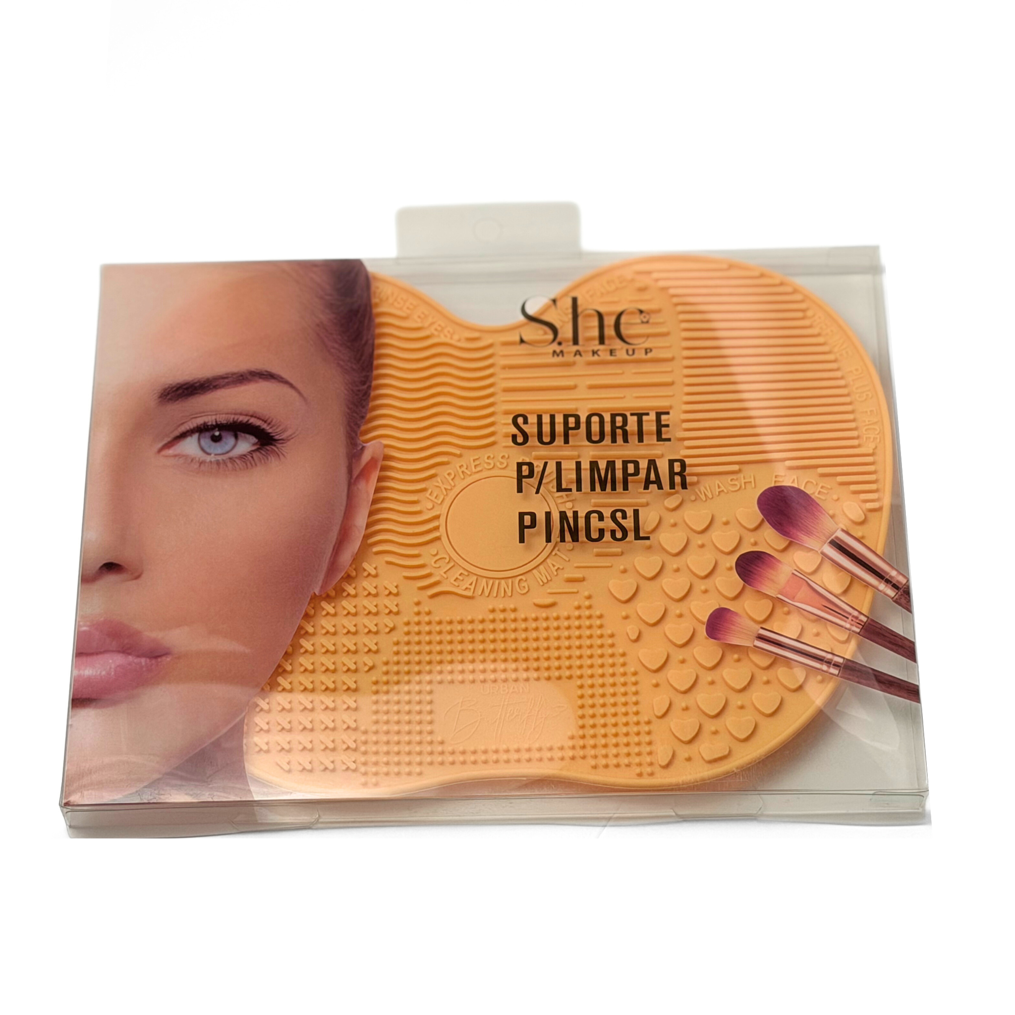 She makeup brand mustard colored silicone brush cleaning mat on a white background.