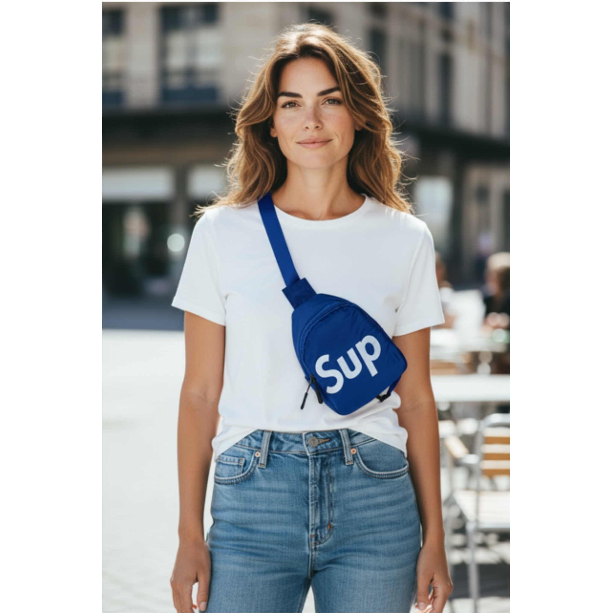 Woman wearing a white t-shirt with Sling Bag with white 'Sup' logo and blue jeans.