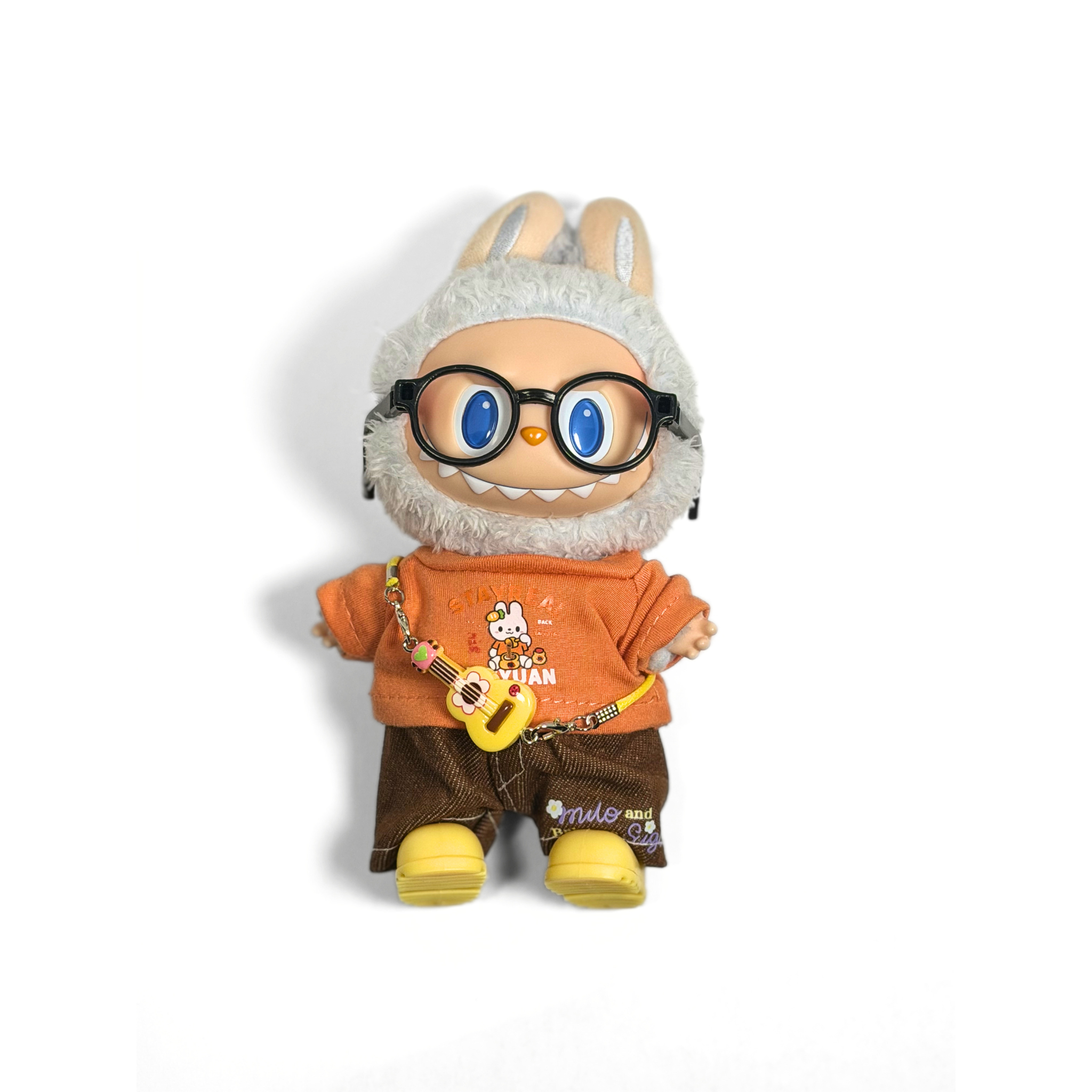 Bubu Outfit: Orange Tee, Brown Pants, and Yellow Guitar