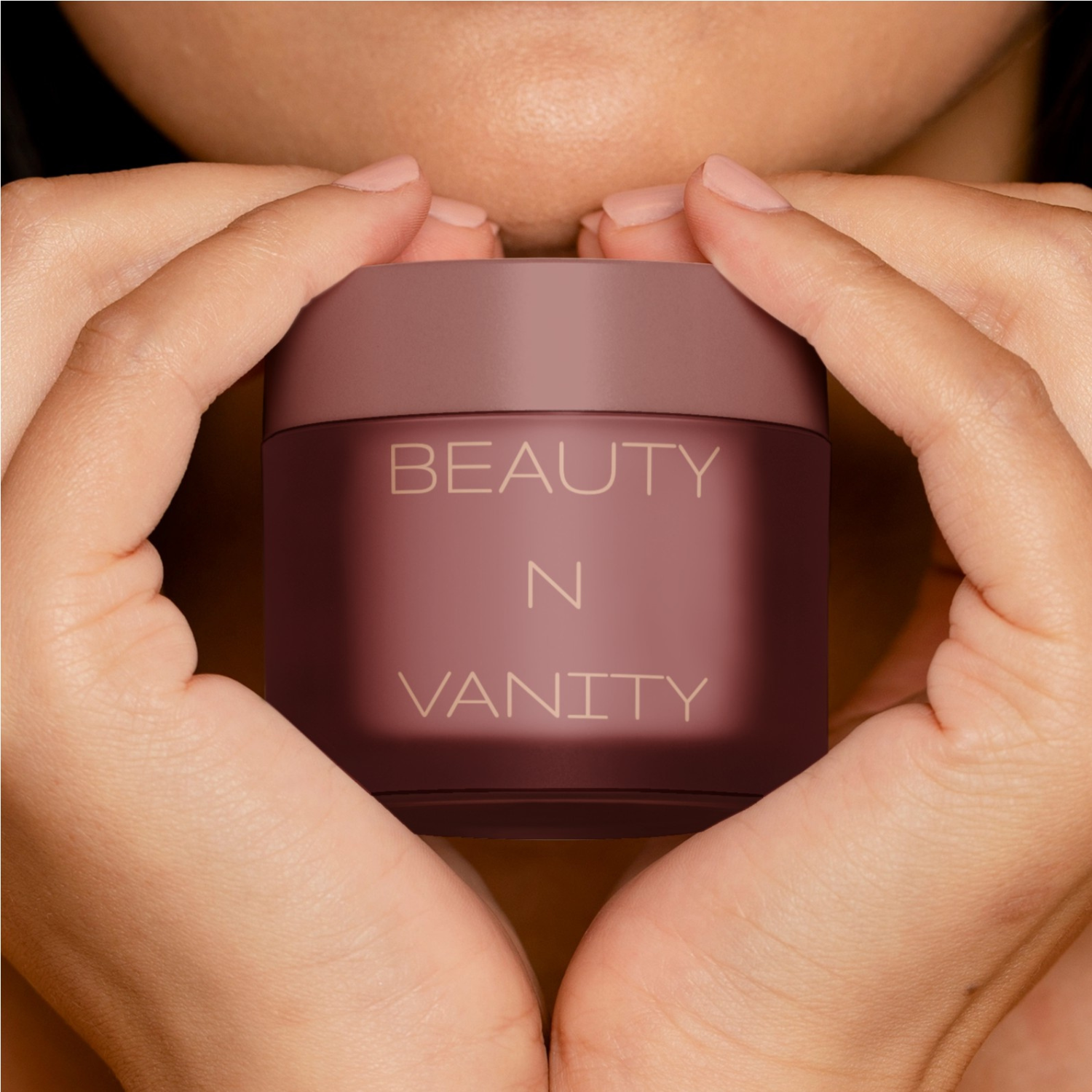 Person holding a 'Beauty N Vanity' beauty jar between their hands. This image is meant to showcase the product category for Beauty N Vanity Website.