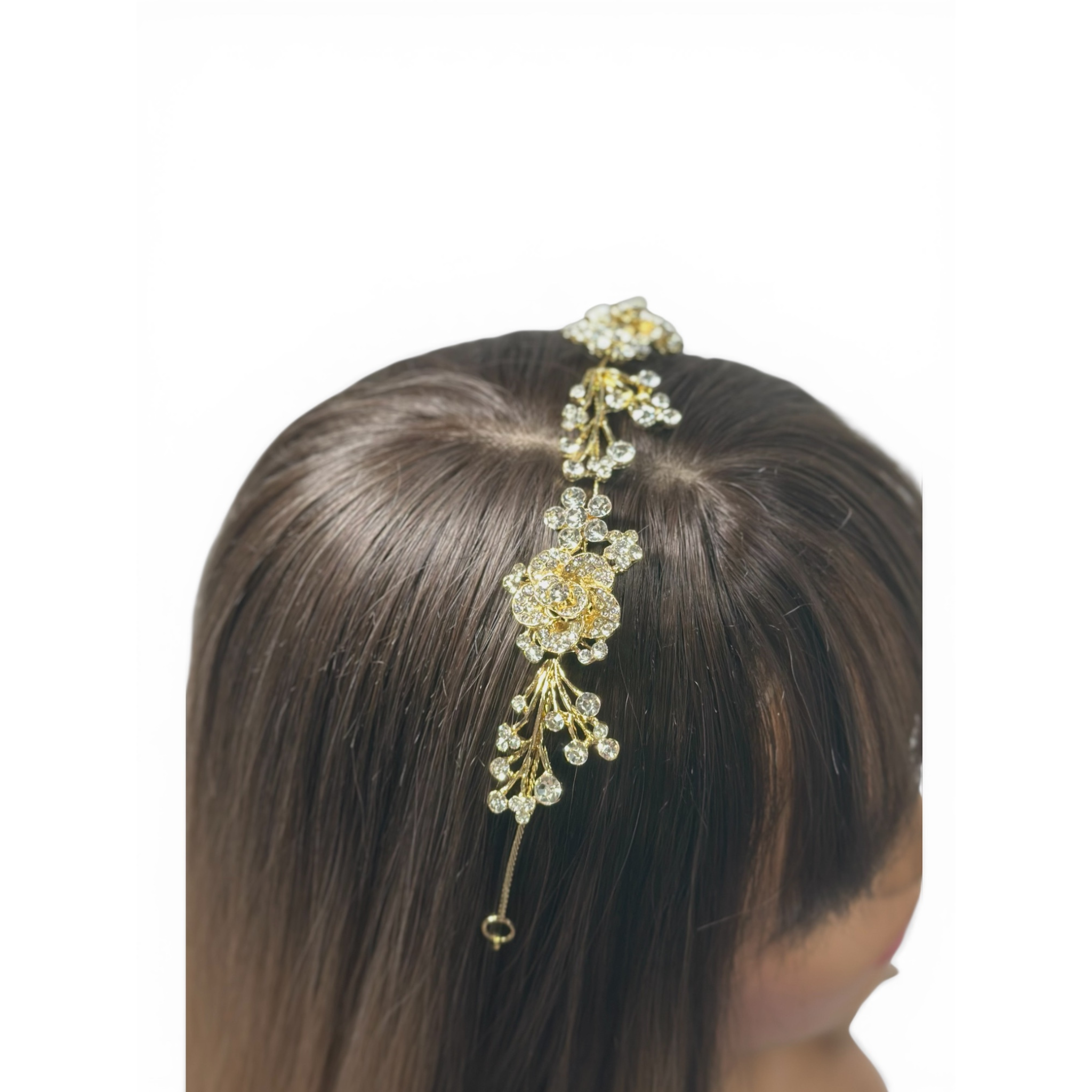 This image showcases the Gold floral hair accessory on a person's head against a white background