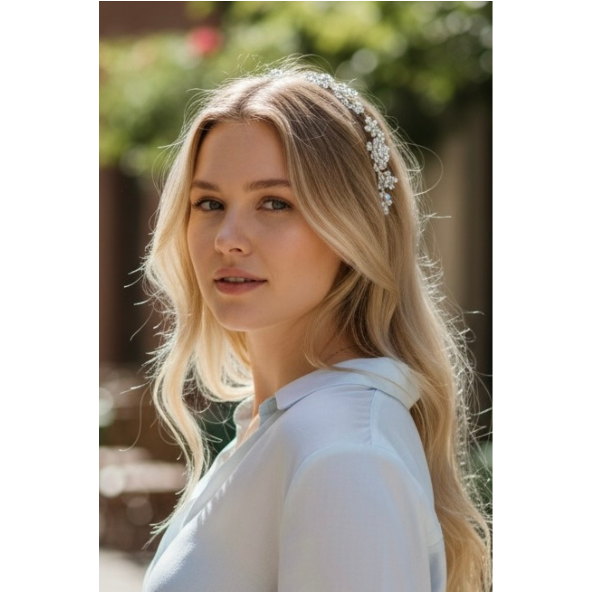 Woman wearing a decorative headband outdoors with blurred greenery in the background