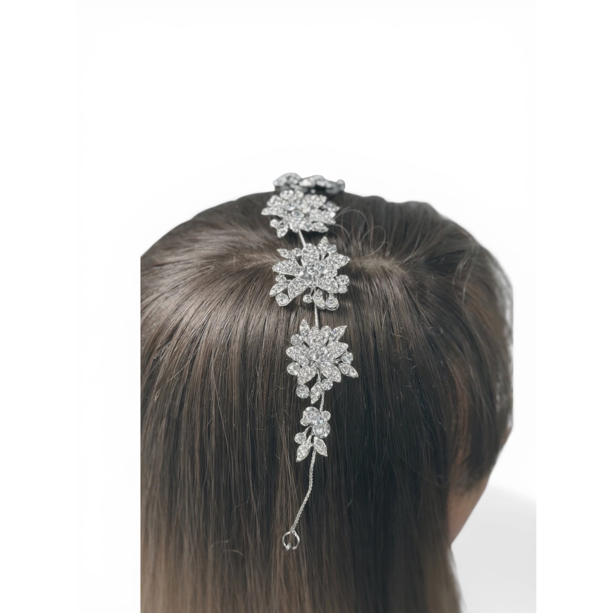 Silver floral heaband hair accessory on a woman's head against a white background