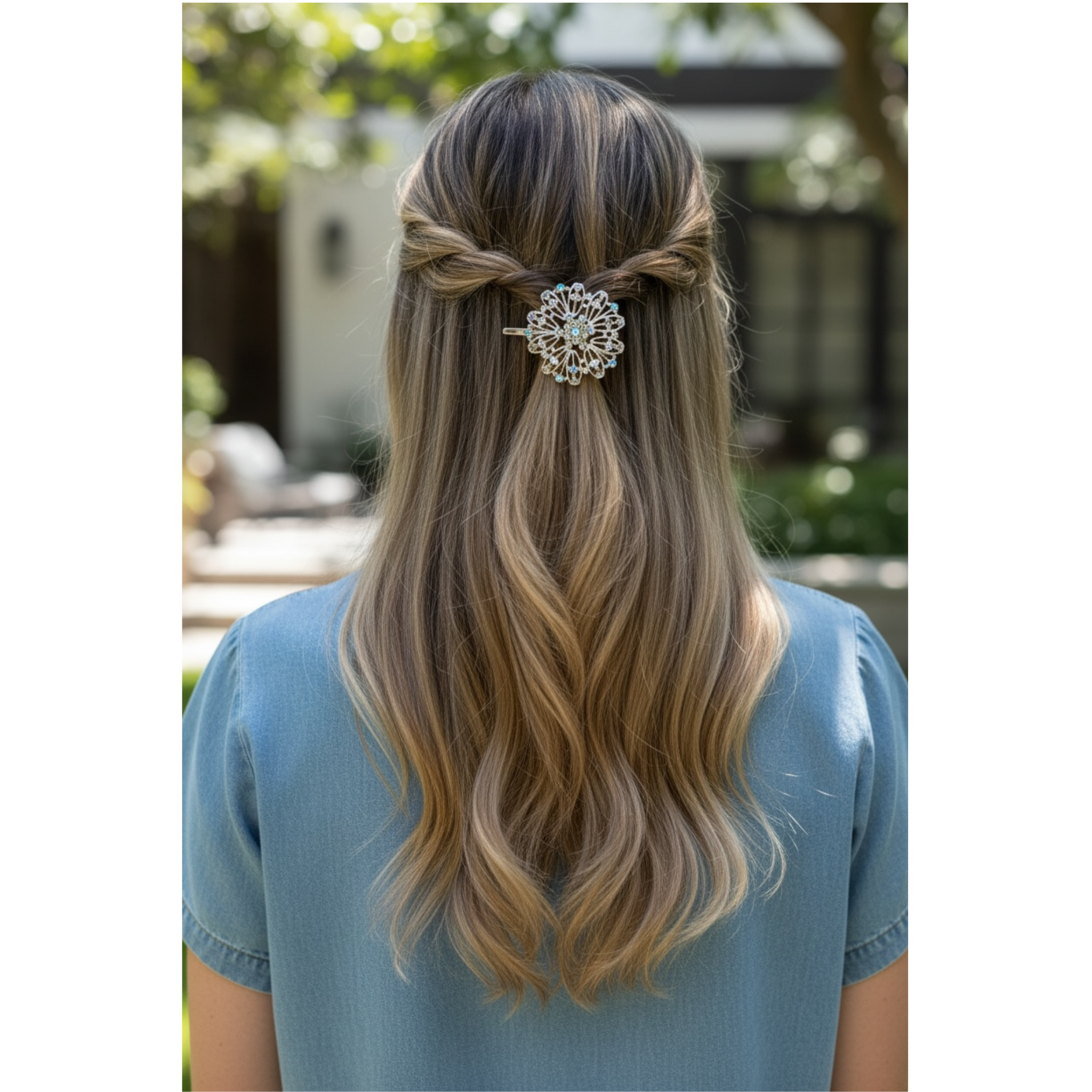 Person with styled hair featuring a decorative hair clip outdoors