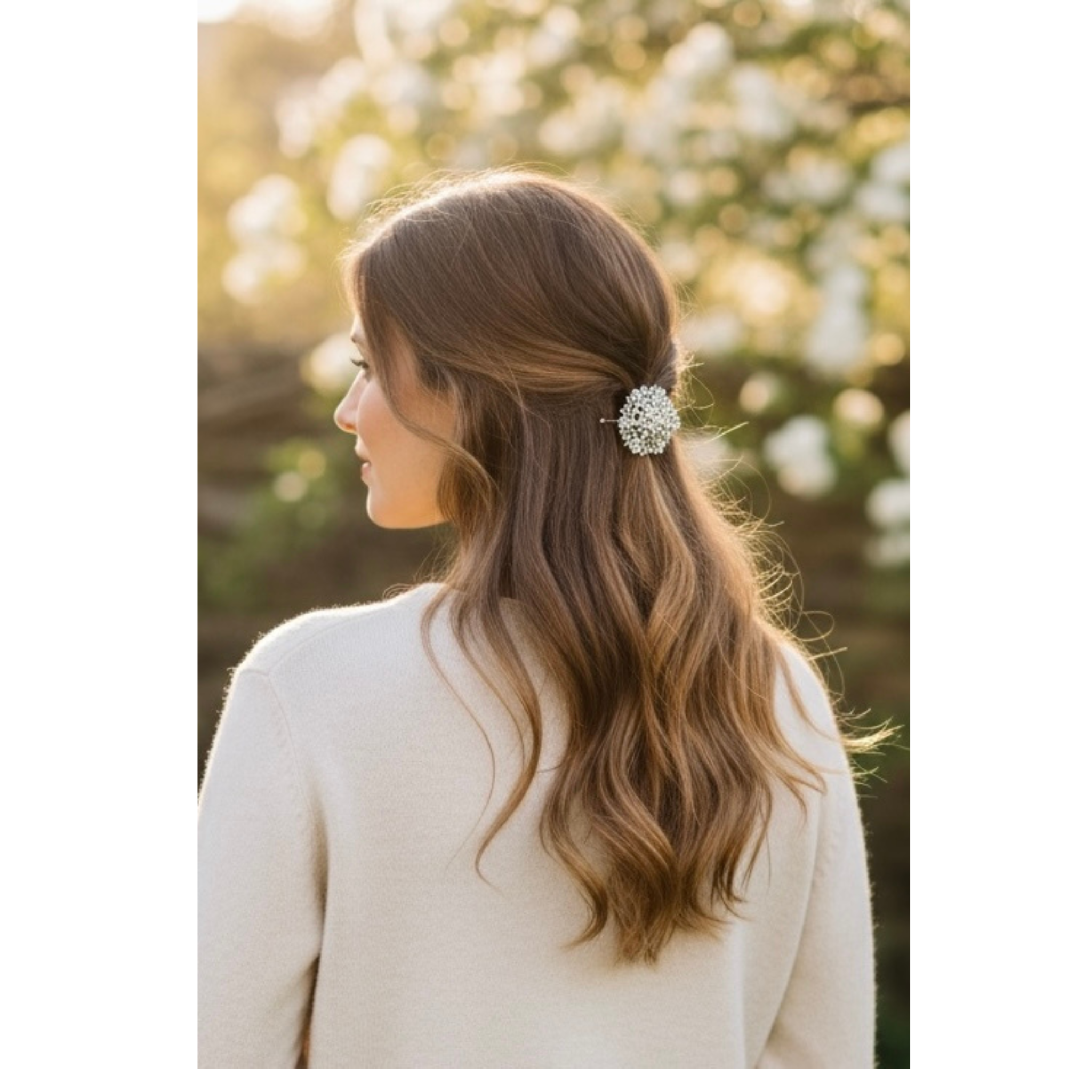 Woman with long hair wearing a decorative hair clip outdoors