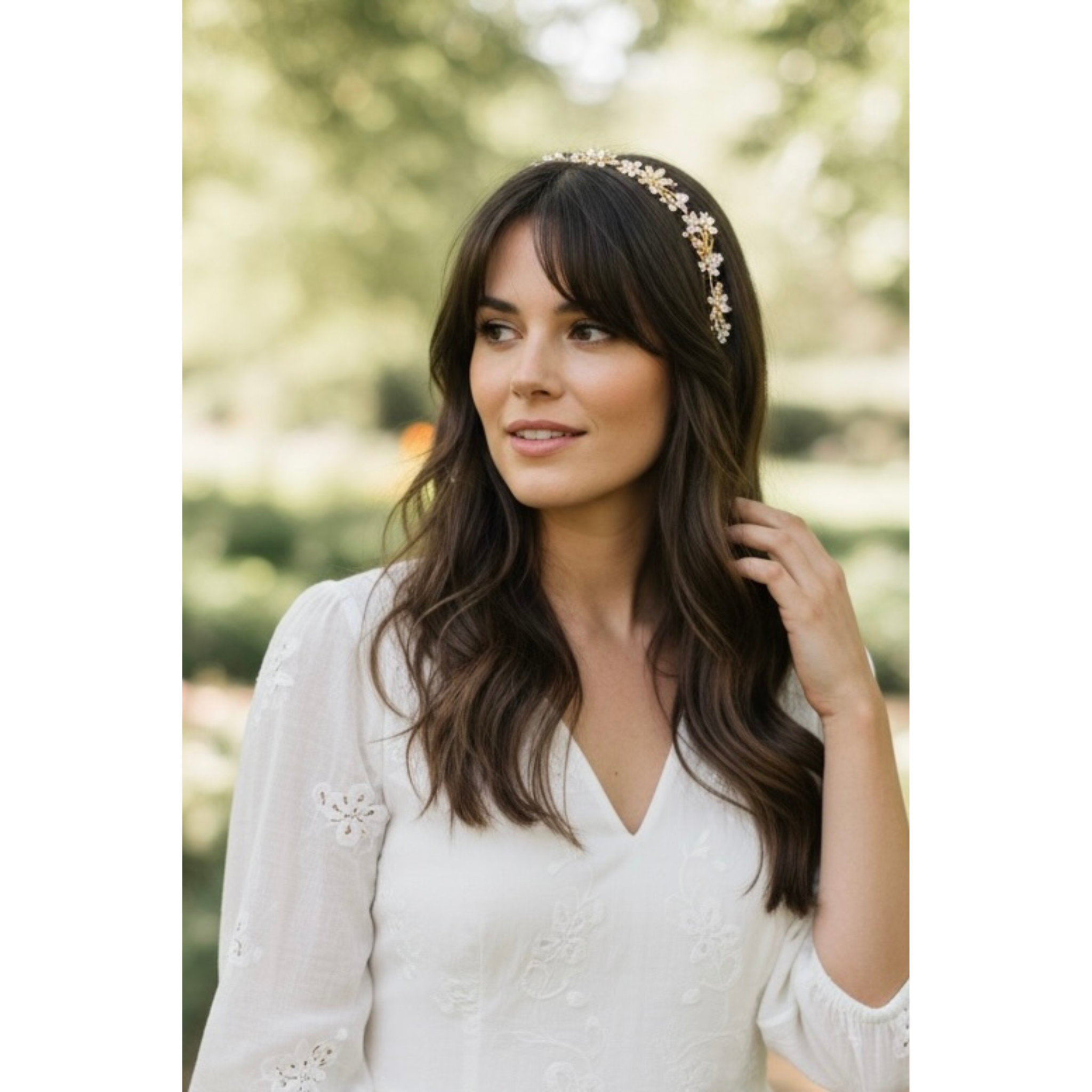 Woman wearing a floral headband outdoors with a blurred natural background