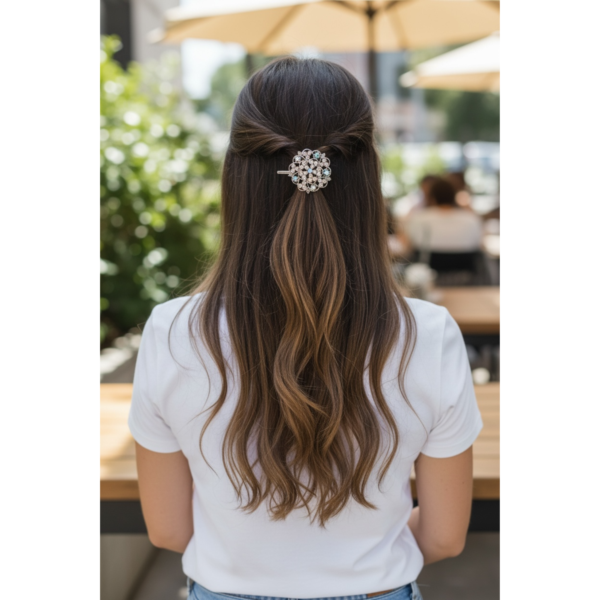 Person with long hair wearing a decorative hair clip outdoors