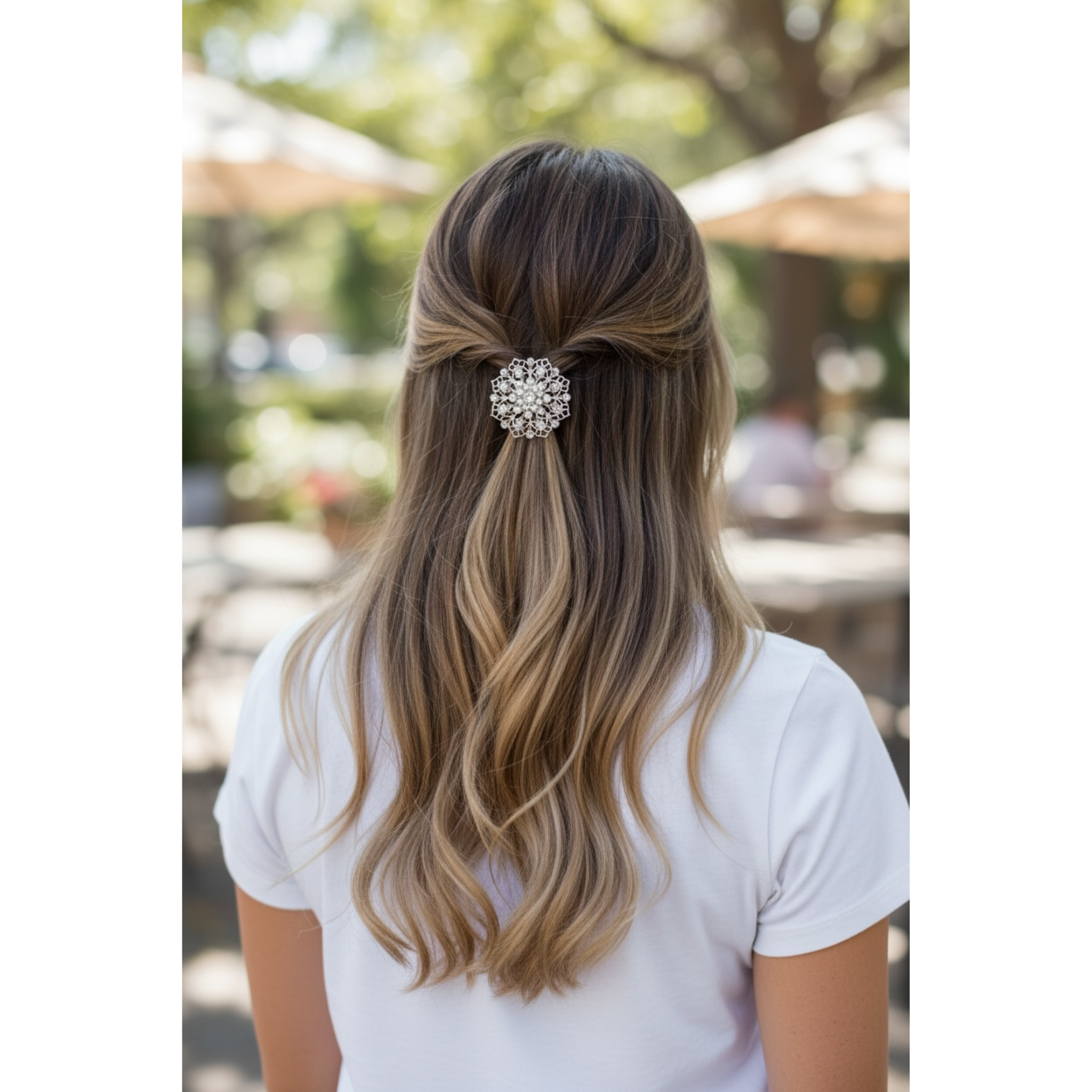 Person with styled hair featuring a decorative hairpin outdoors