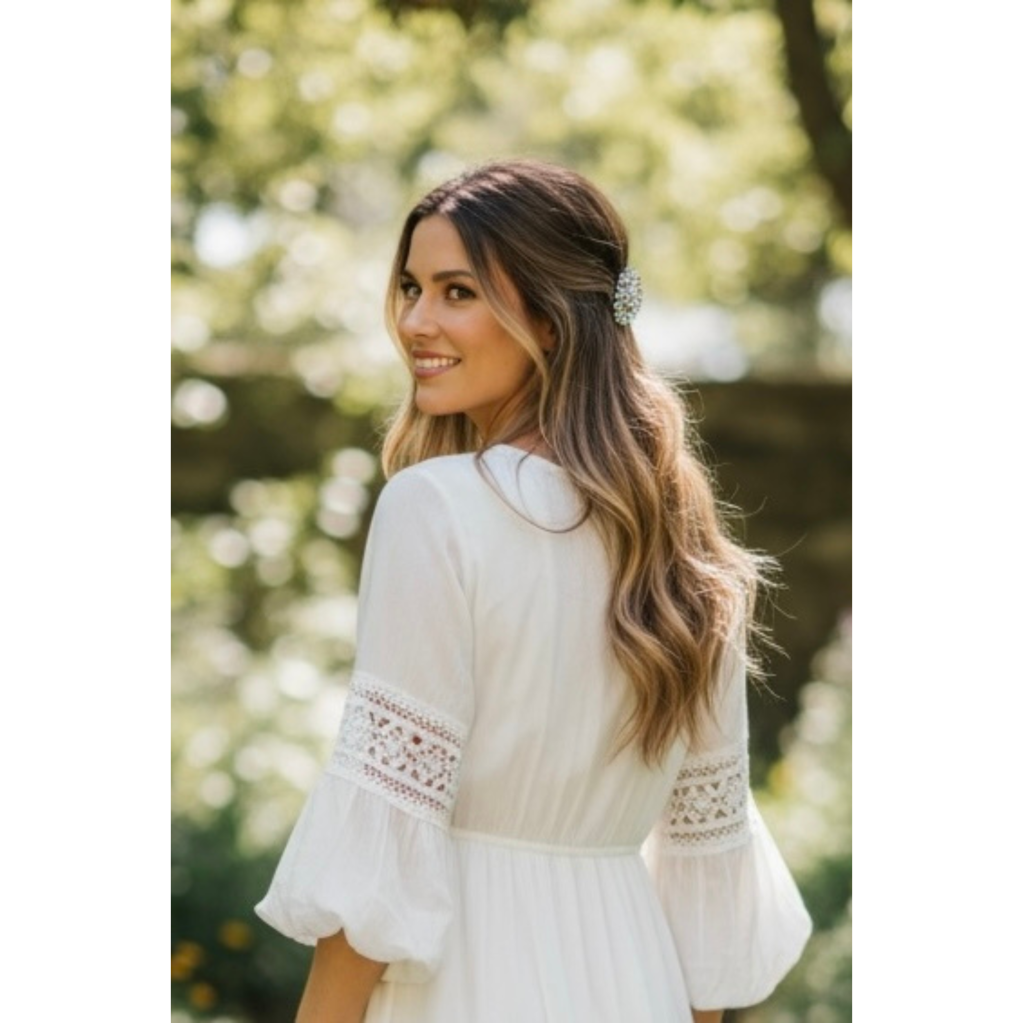 Woman wearing a white blouse with lace details outdoors. This image highlights the hairclip 