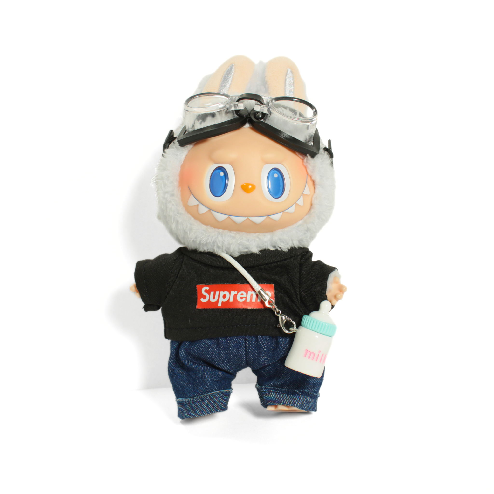Toy figure wearing a Supreme t-shirt on a white background
