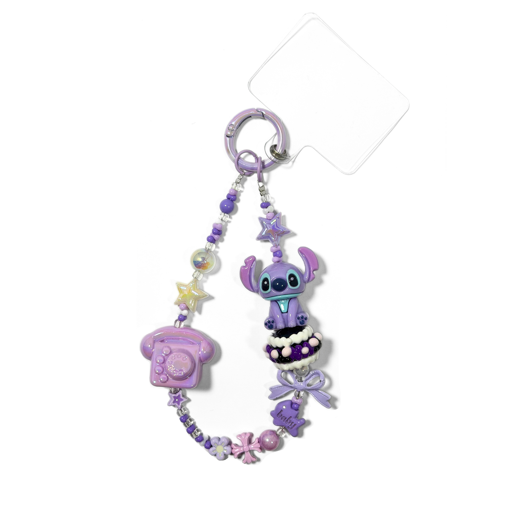 Decorative keychain with stitch from lilo & Stitch with decorative beads on a white background