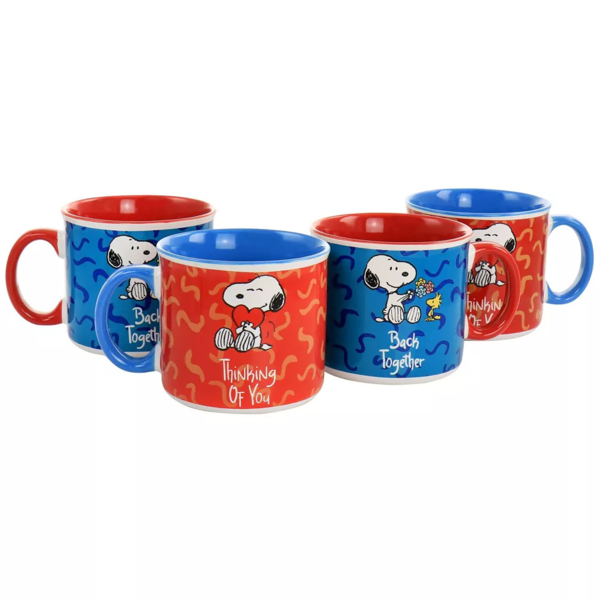 Set of four Snoopy-themed mugs with colorful designs on a white background