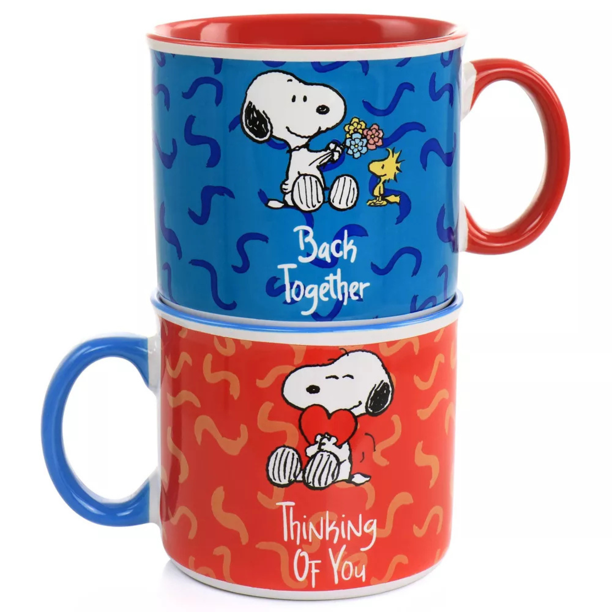 Two stacked mugs with Snoopy and Woodstock designs on a white background