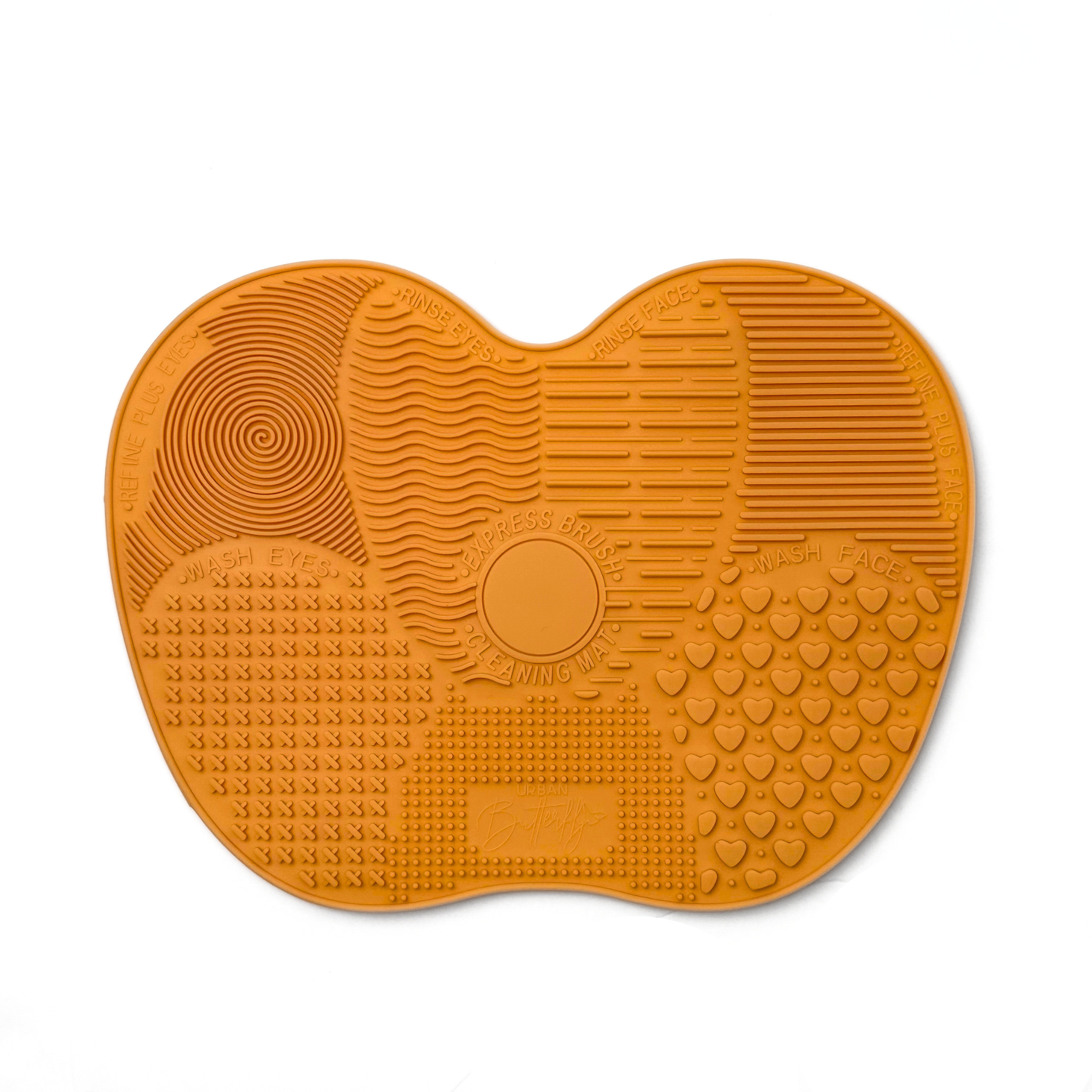 S.he Makeup Brand Brush Cleaning Mat in color Orange on a white background