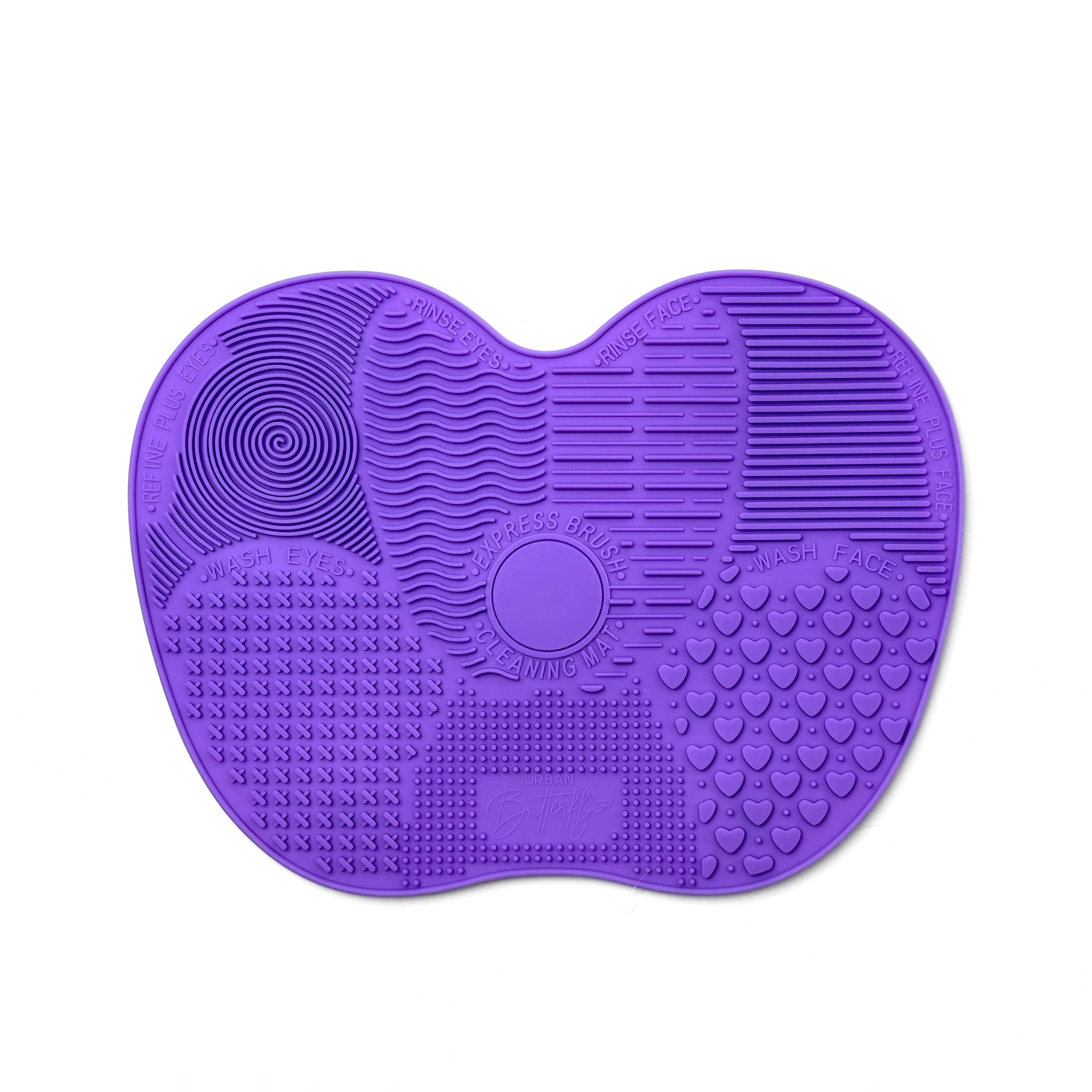 Purple silicone brush cleaning mat with textured surface on a white background